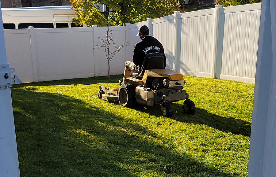 Getting into backyards through tight gates was an issue with some of the other bagging mowers Jeff Wright used, but not the Walker.
Pictured is Jeff’s son Trevor.