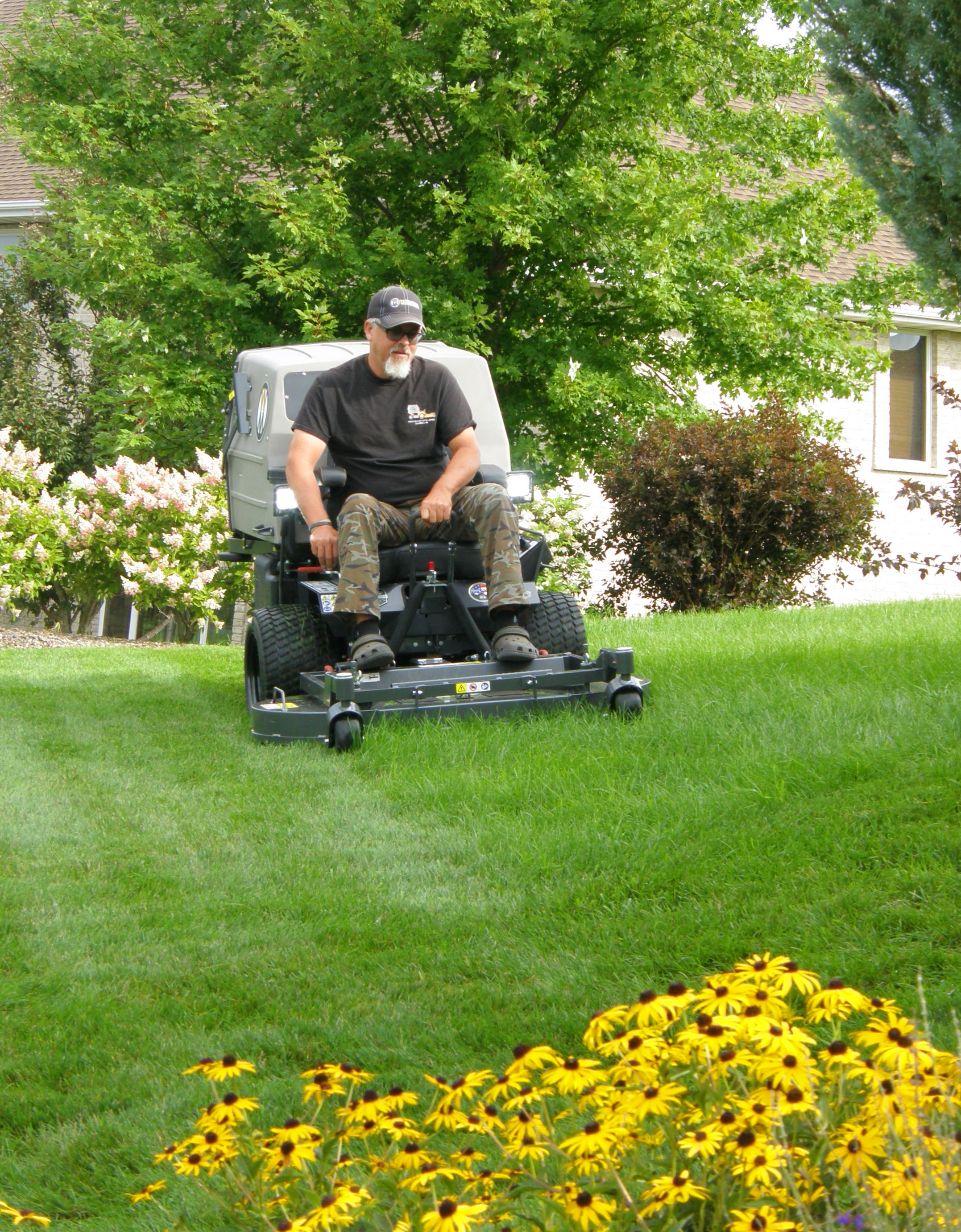 Rick Blosser mowing his lawn